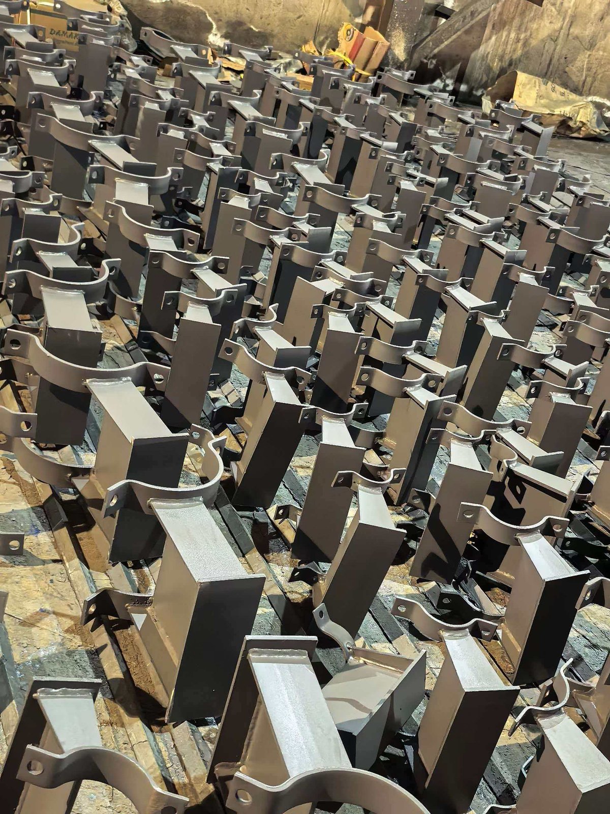 Spring hanger support brackets and clamps in factory workshop