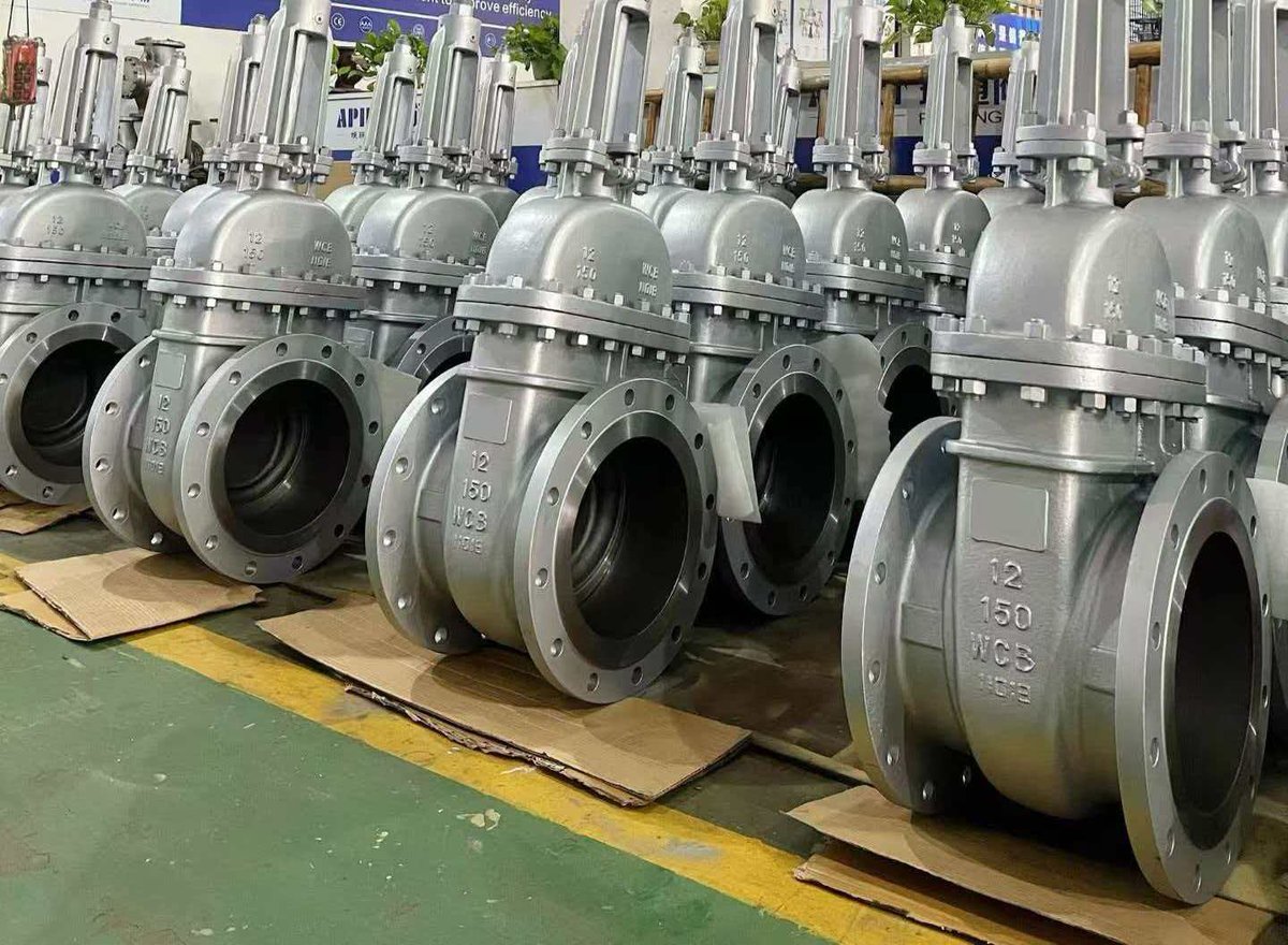 Industrial gate valves in rows on factory floor, cast steel WCB 150 class
